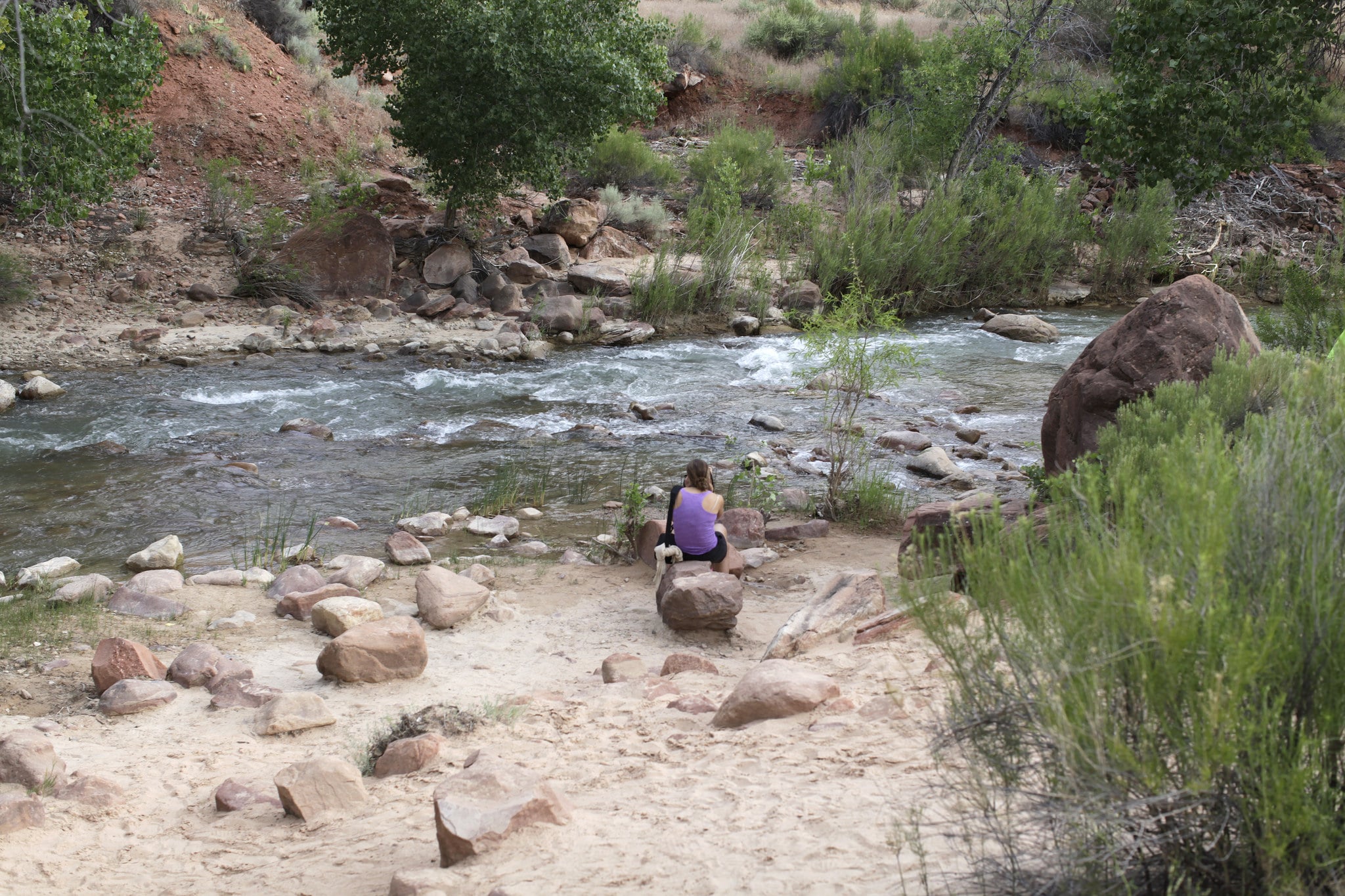 woman at the river in zion national park