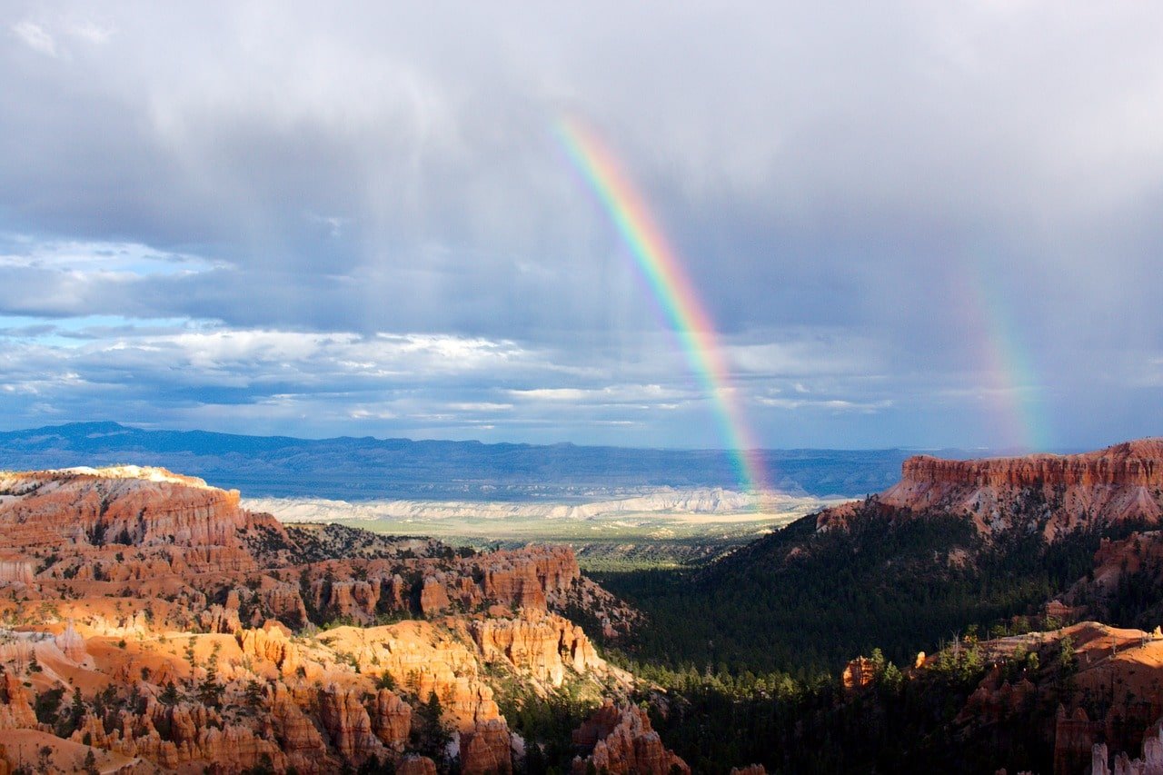 cloudy sky with a rainbow at zion national park 