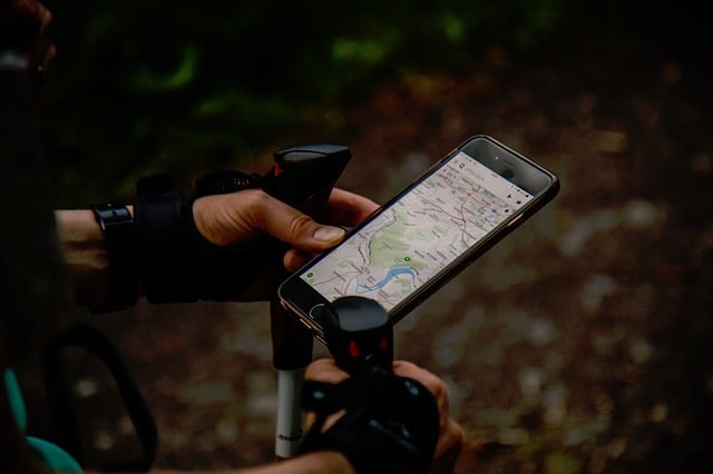 a hiker using gps, one of the things that backpacking beginners may find handy